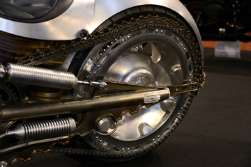 very elaborated rear wheel with chain drive on a custom American motorcycle