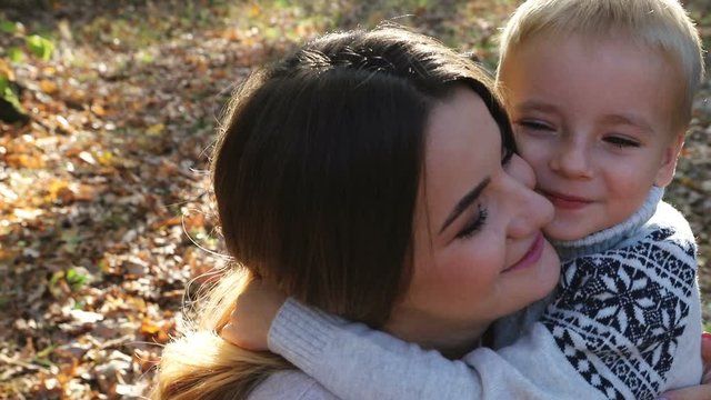 Kid love dearest mommy after strongly embracing each other long time apart