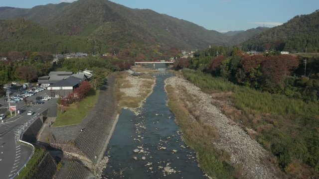 Aerial view of Echi river flowing past traditional Onsen bath house in Shiga Prefecture, Japan
