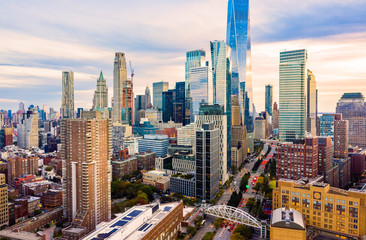 Aerial view of Lower Manhattan skyline at sunset viewed from above West Street in Tribeca...