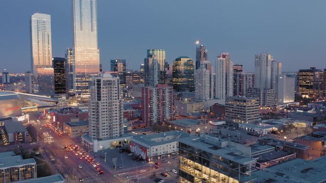 Aerial: Establishing shot of the Edmonton city skyline at night. Edmonton, Alberta, Canada. 1 April 2019