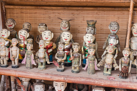 Colorful souvenir puppets used in the ancient art of water puppetry (Roi Nuoc)