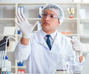 Young researcher scientist doing a water test contamination expe