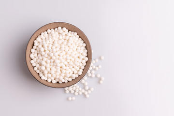 Tapioca pearls or sagu seeds, isolated on white background, soft light, studio photo