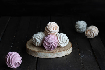 Assorted different flavors of homemade marshmallows. Peach, pink and white marshmallows.