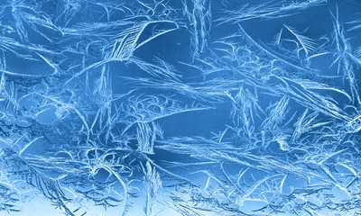 Frost patterns on window glass in winter