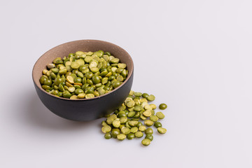 Split dried uncooked peas isolated on white background, close-up, studio shot, soft light, copy space. Christmas dish