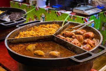Close up photo of traditional polish food beind served in a market stall in Poznan, Poland during traditional Christmas Market. 