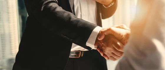 Tuinposter businessman handshake for teamwork of business merger and acquisition © Mongkolchon