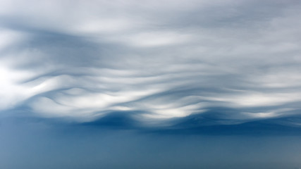 Fototapeta premium Wavy panoramic sky and gloomy clouds.