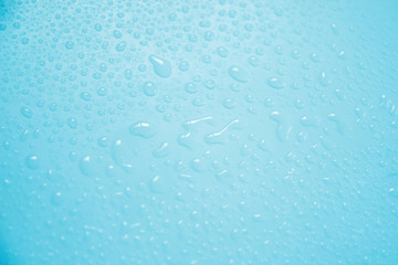 splashes of water drops on a blue background