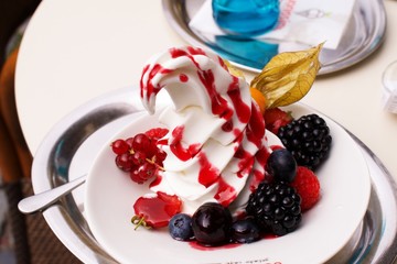 Close up on frozen dessert, ice cream with wild berries