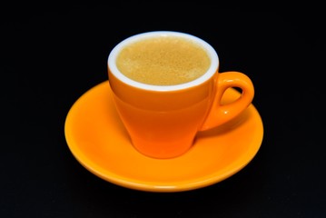 A cup of espresso coffee on black background 
