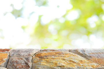 Stone table top on blurred green bokeh background