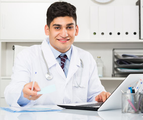 Male doctor is giving the conclusion about health of client