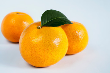 Fresh juicy orange fruit set over white background - tropical orange fruit for background use