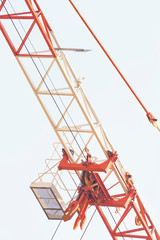 Fototapeta na wymiar The boom of a construction crane on sky background