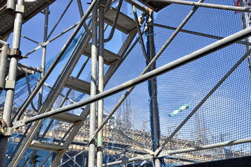 High-rise building site: construction scaffolding and stairs