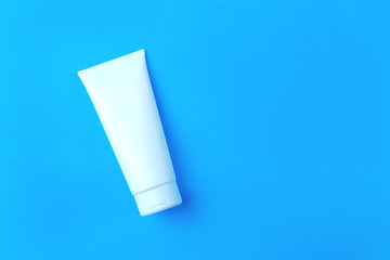 White clear tube on blue background space for text.