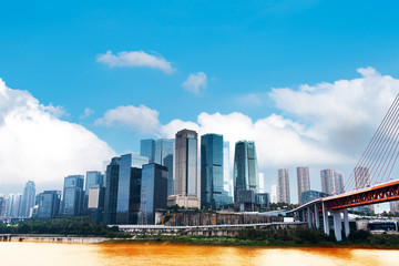 Landscape of downtown near water in blue sky