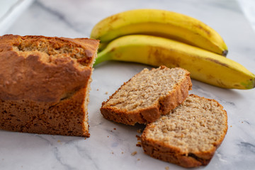 Fototapeta na wymiar Healthy home made banana bread or cake for breakfast on a table