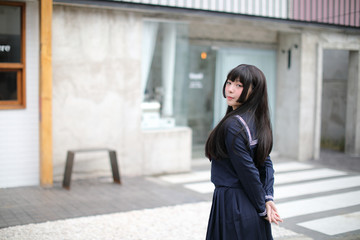 Portrait japanese school girl in downtown ice cream shop