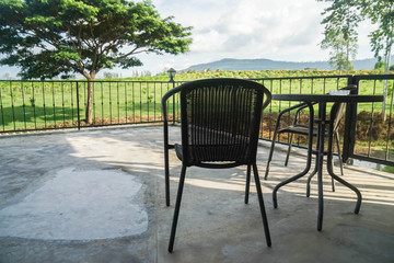 Fototapeta na wymiar table and chair at house terrace for garden view