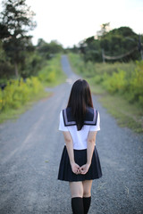 Portrait of asian japanese school girl costume looking at park outdoor