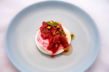 Rhubarb on the top of Pavlova of meringue