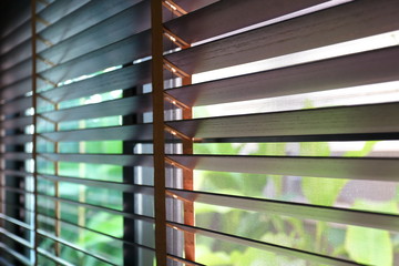brown blind shade and mosquito wire screen on window, interior design decoration in home office