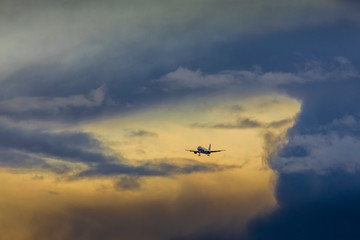 commercial plane flying at sunset,.Palma Mallorca, Spain