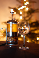 Teapot french press with green tea and glass with water
