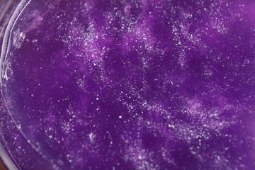 Closeup view of purple slime with glitter. Antistress toy