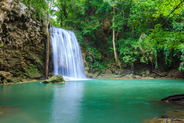Fototapeta na wymiar Waterfalls In Deep Forest at Erawan Waterfall in National Park Kanchanaburi Thailand