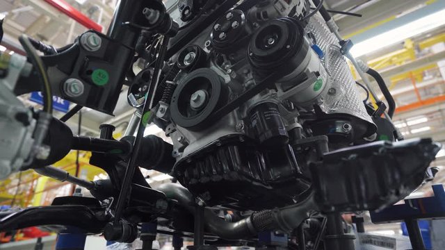 Automobile plant, view of power units and engines for a new car, modern production of cars, assembly line of cars.
