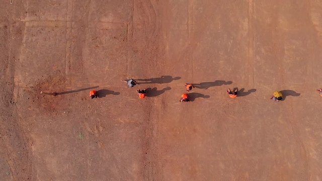 drone shot of school kids playing Indian sports Kho-Kho  in sed sand of Maharashtra
