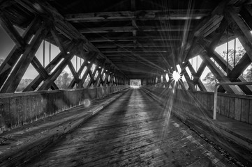 wooden bridge at sunset in bavaria in autumn in black and white