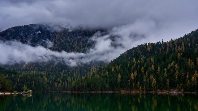 low clouds rolling across alpine scenery at Blindsee Lake in Ehrwald, Austrian Alps