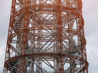 Metal openwork radar tower. Telecommunication antenna tower