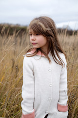 girl in a wheat field in autumn