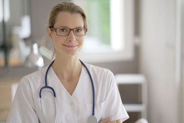 nurse facing camera in an office