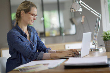 young blond woman working in an office