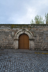 Ancient door in the city of Avila. Castilla y León, Spain.
