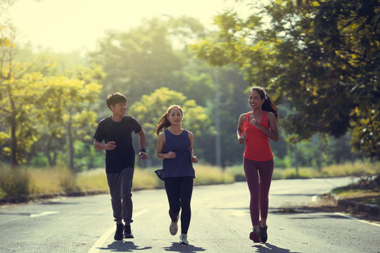 Asian Friends Group Jogging In The Morning