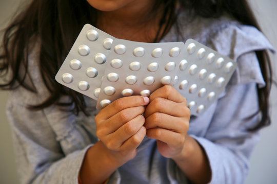Methylphenidate ( Ritalin ) of Psychostimulants on Girl's hand. Attention deficit hyperactivity disorder (ADHD)