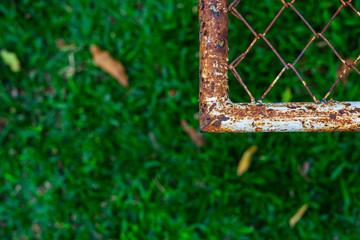 Green background with decaying rust