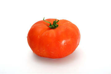 Delicious red tomato on a white background.