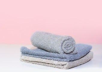 Stack of bath towels on background closeup