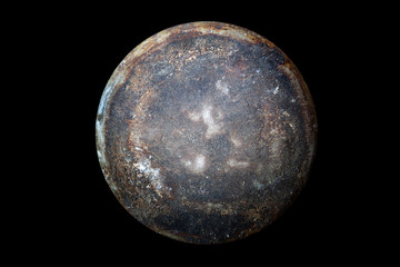 Abstract image of planet Jupiter from the surface of an old griddle on a black background in space.