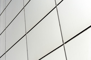 Detail shot of modern architecture facade.Texture of modern composite materials. Abstract background.The facade of the buildings is finished with a metal profile.